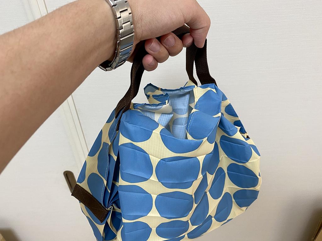 article-files/20/ggv3rqg0c6gntea6pl9ji6ltzmhn.jpeg Shupatto - A Compact and Convenient Shopping Bag